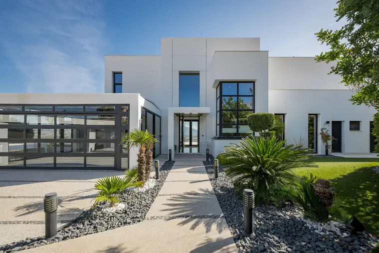 Some homes impress with their setting. Others with